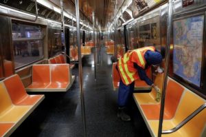 During outbreak of coronavirus disease (COVID-19) in New York ,a worker wipes down surfaces as the MTA Subway closed overnight for cleaning and disinfecting